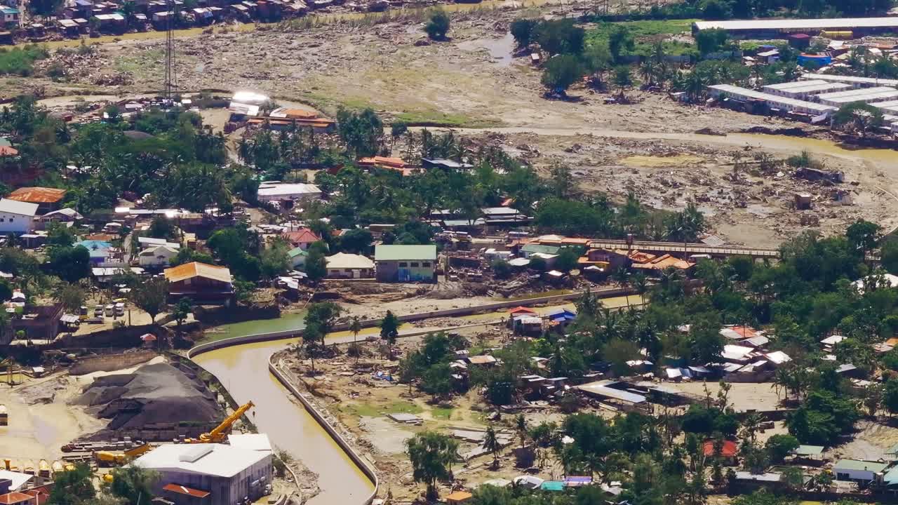 Vertical tilt over Mananga River flood damage near Cebu City, Cebu Philippines