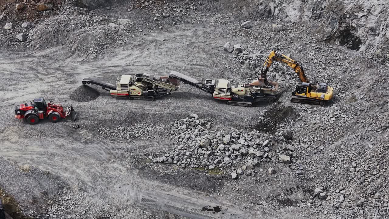 Aerial View of Heavy Machinery Crushing Rocks in a Quarry