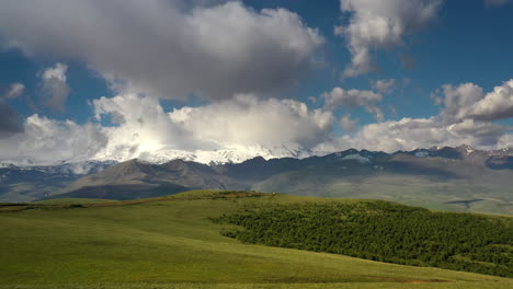 Elbrus-Region.-Flying-over-a-highland-plateau.-Beautiful-landscape-of-nature.-Mount-Elbrus-is-visible-in-the-background.