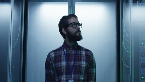 it professional inspecting a server room