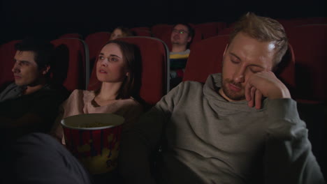 Man-sleeping-in-the-cinema