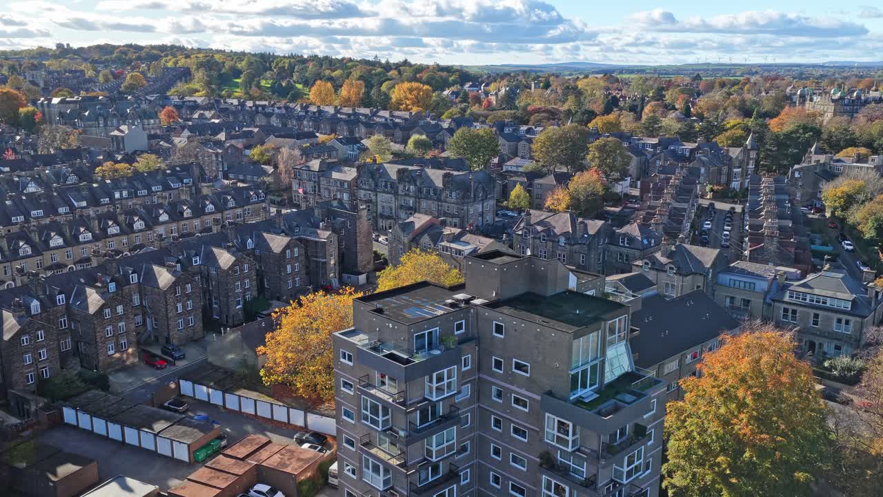 Aerial view over Harrogate reveals a modernist mid-century apartment block rising above classic Victorian terraces, autumn trees, and residential roofs