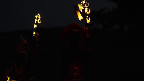 fire dancers at night