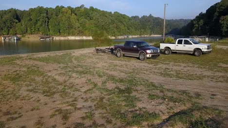 two trucks at the lake