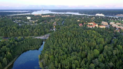 Calm-lake-filmed-from-above-with-big-boat-in-distance