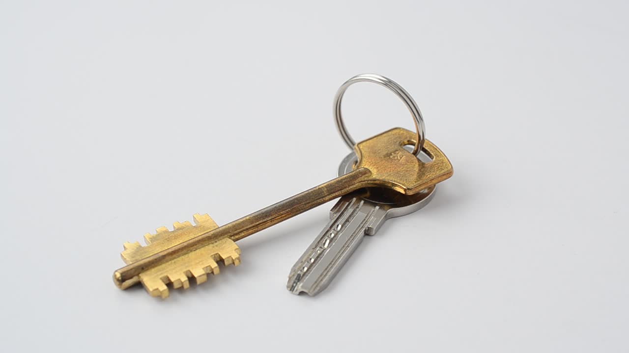 Keys on a white background. Shooting in the movement