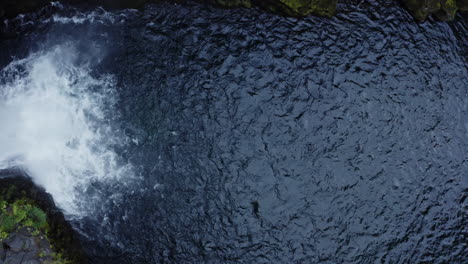 top down aerial shot of toketee falls in oregon, slowly rising upwards