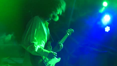 guitar player playing live on stage music show