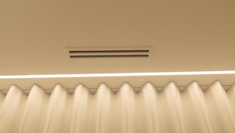 slow establishing shot of electronic curtains and air conditioning panels
