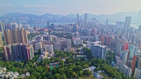 a dynamic aerial footage of the cityscape of mong kok area in kowloon, hong kong