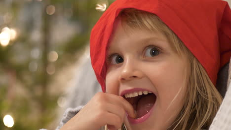 close up portrait cute young girl on christmas, expressions of excitement and anticipation