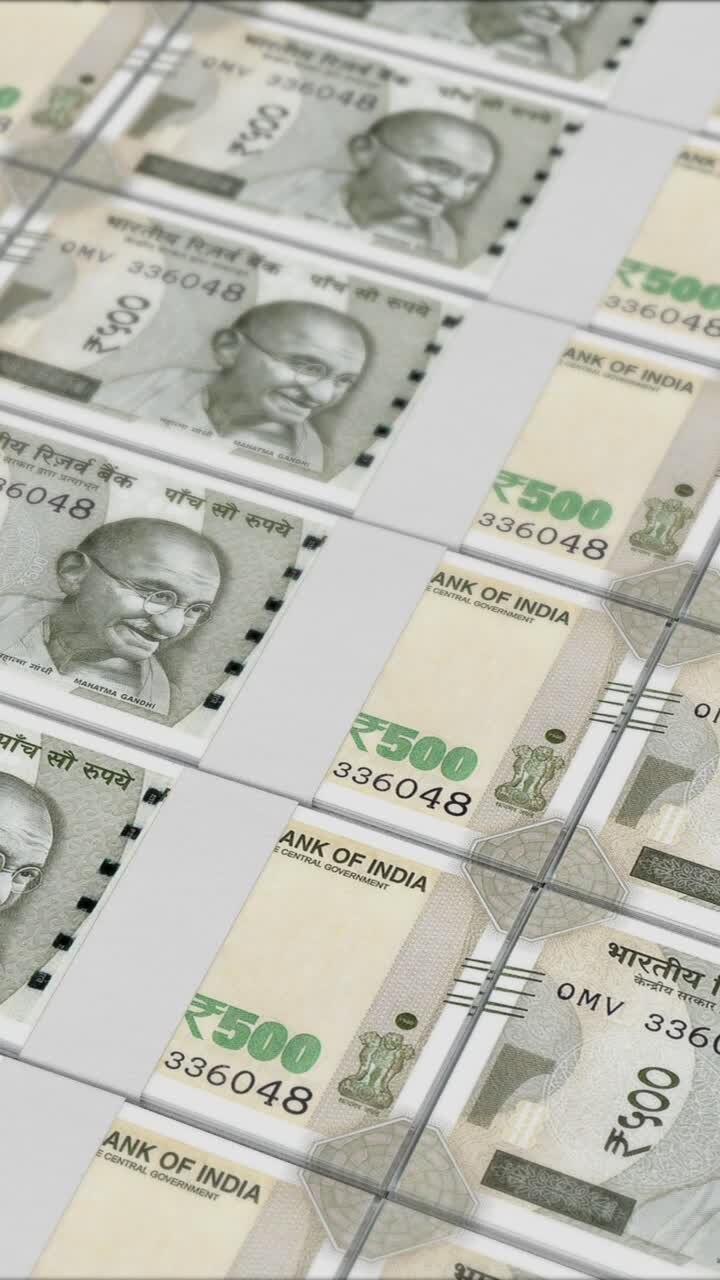 Vertical video of 500 RUPEES banknotes printing by a money press