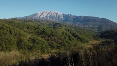 Epic-view-of-mountain-foothill-volcano-in-Asia-Middle-East-green-forest-in-summer-travel-destination-to-Saudi-Arabia-Persian-Gulf-green-fresh-eco-lodges-in-forest-deep-nature-concept-of-adventure-trip