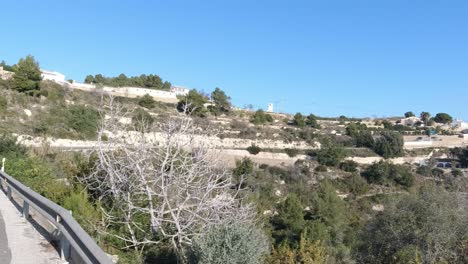 Cyclists-climbing-a-hill-near-Calpe-Alicante-Spain