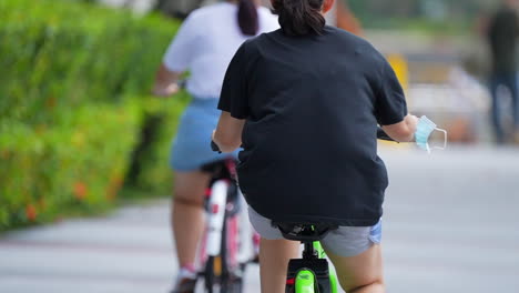 women cycling in singapore slow motion marina bay front