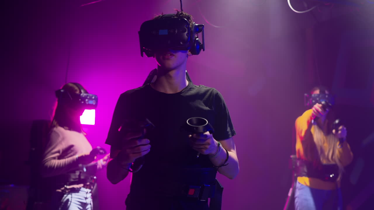 Teenagers playing with a Virtual Reality headset in a studio