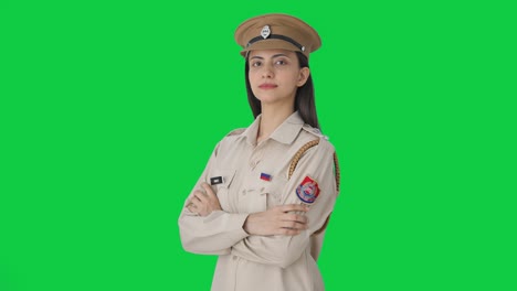 Portrait-of-Indian-female-police-officer-standing-crossed-hands-Green-screen