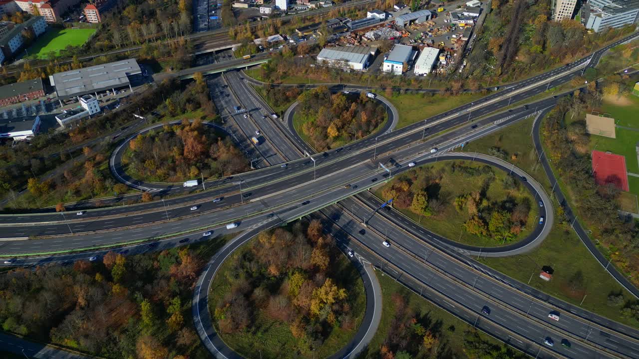 Complex highway interchange with cars traversing roads in Berlin. Bird's eye view drone camera pointing down. Nice aerial view flight top down drone view
