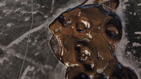aerial of icy volcanic pseudocraters in winter near skútustaðir by mývatn lake in iceland