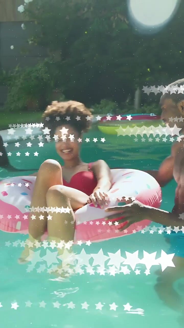 Vertical video: Edge toss starting ball play, woman on pink donut reaching, star overlay for health