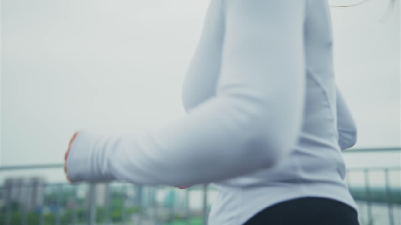 Woman running outdoors for fitness
