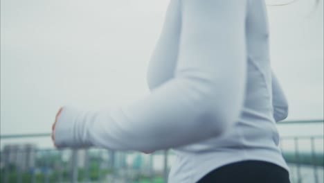 woman running outdoors for fitness