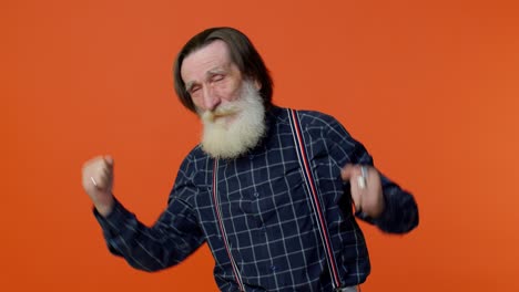 elderly bearded gray-haired grandfather man listening music, smiling dancing to music, having fun