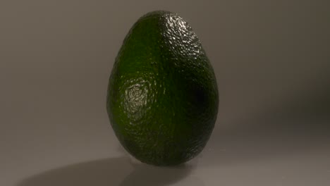 ripe green avacado on a white background