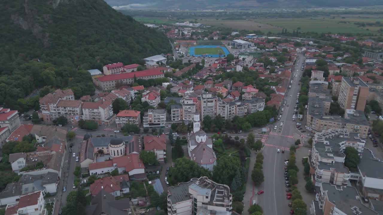 Aerial capturing the Episcopal Cathedral of St. Nicholas in Deva, showcasing its architecture and surrounding urban landscape