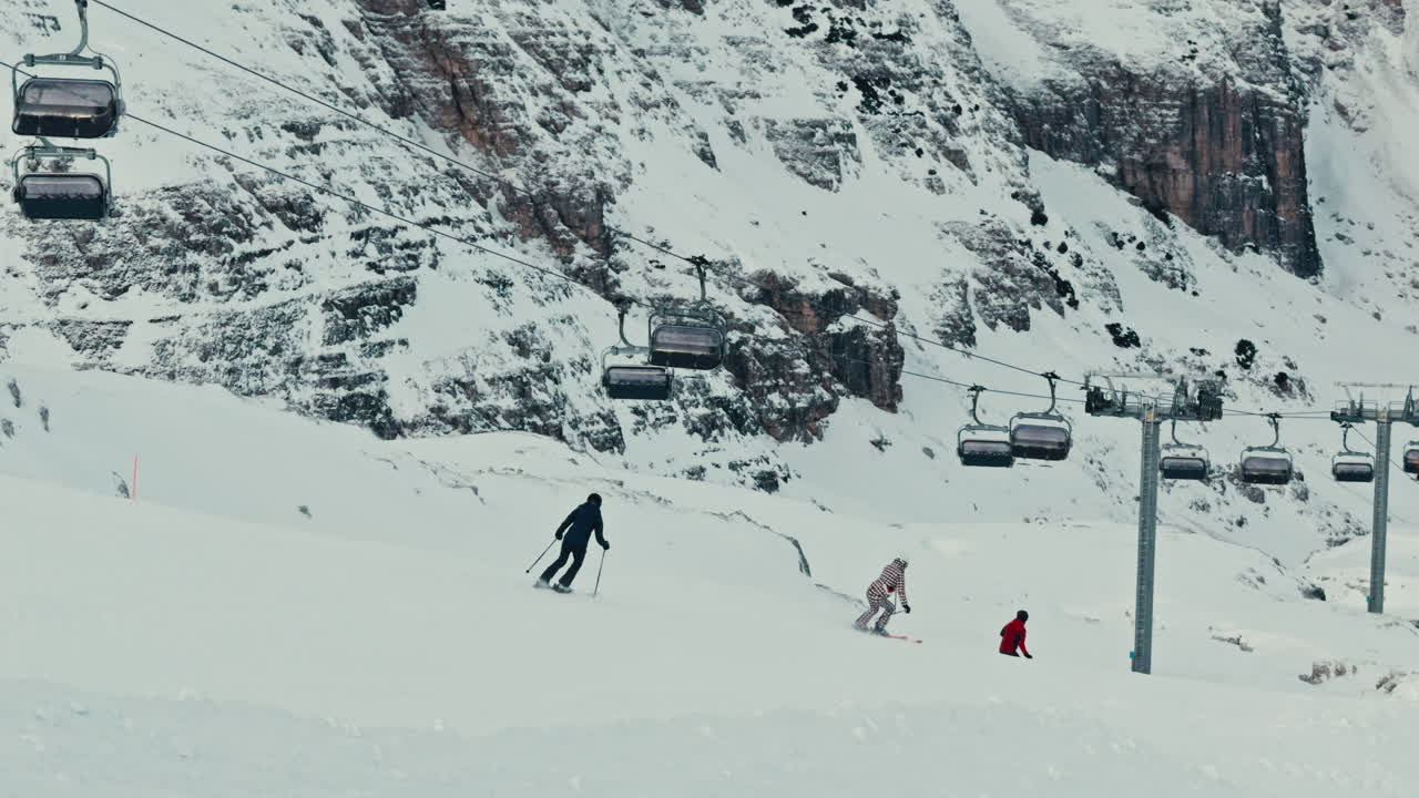 Winter view of winter alpine peaks in the Dolomites with skiing with fresh snow on peaks