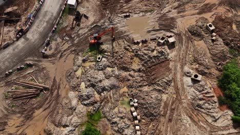 aerial view of an active construction site with heavy machinery and excavation work.
