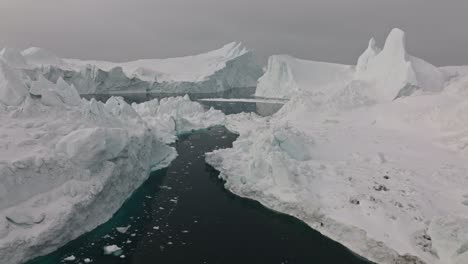 drone over sea and ice of ilulissat icefjord