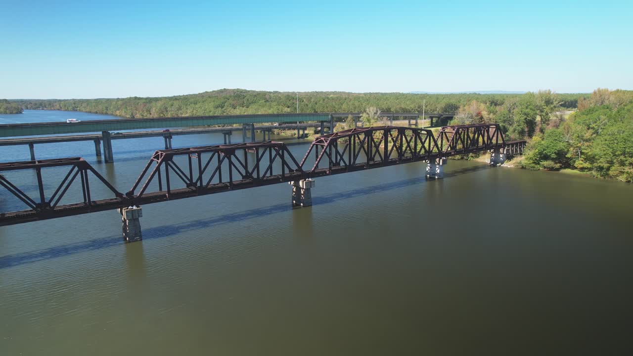 Aerial fly-over of a Parker-truss railway bridge