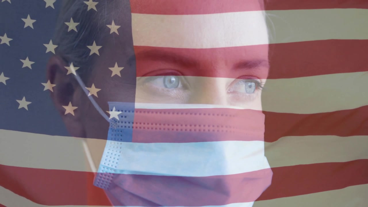 Mid adult woman wearing surgical mask with shifting US flag overlay, showcasing health solidarity