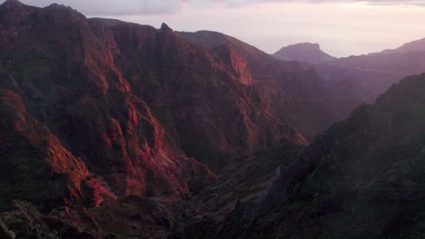 Aerial-of-golden-hour-mountain-faces,-Madiera,-Portugal