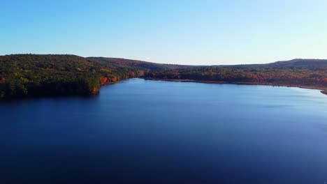 a still shot of a lake in maine during the fall