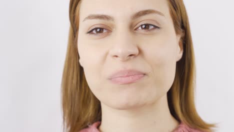 Close-up-woman-eats-nuts-and-dried-fruit.