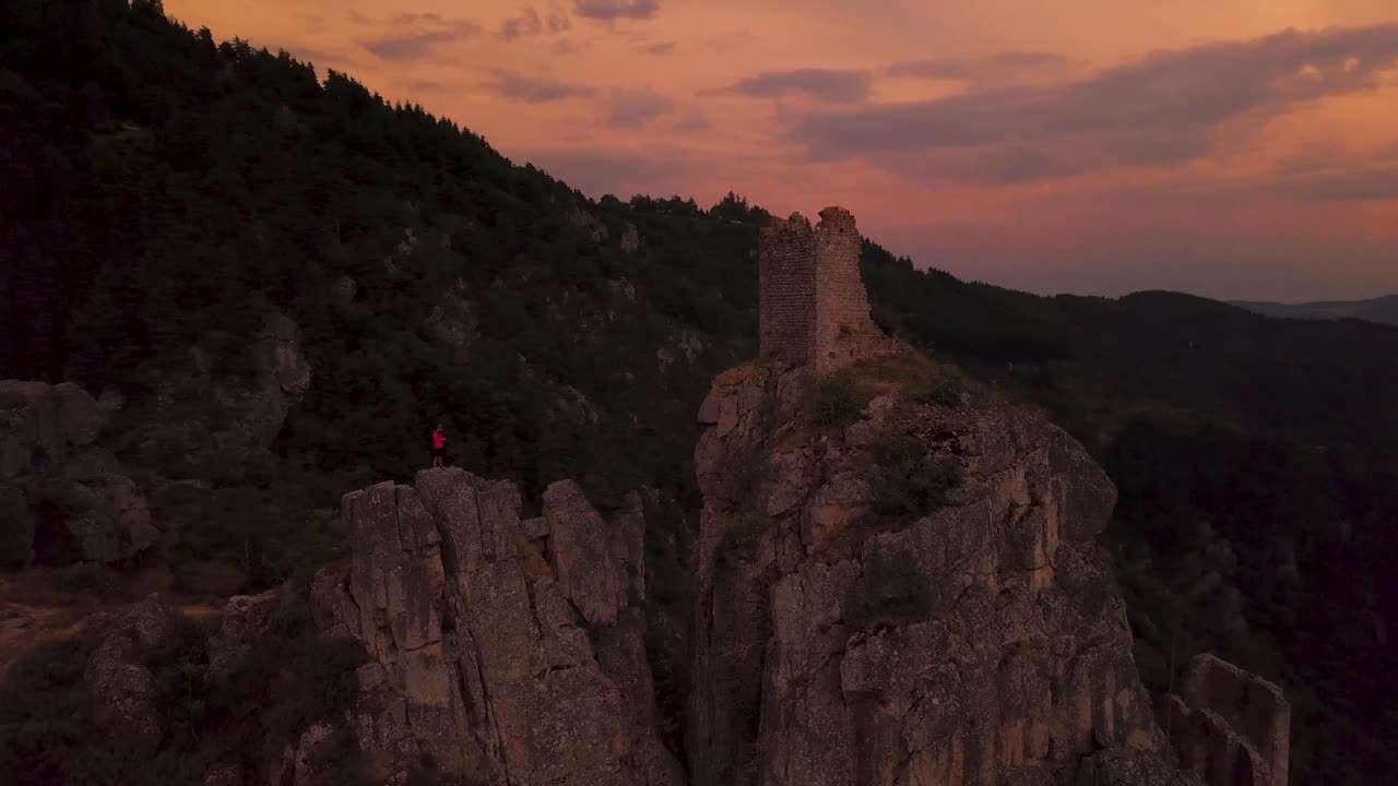 Aerial shot of Rochebonne Castle in Saint Martin de Valamas at sunset in Ardeche departement, Auvergne Rhone Alpes region, France
