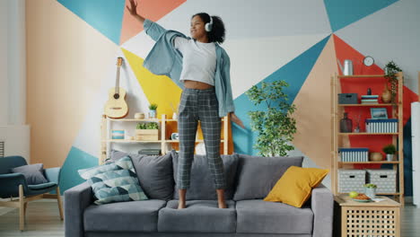 woman dancing on sofa