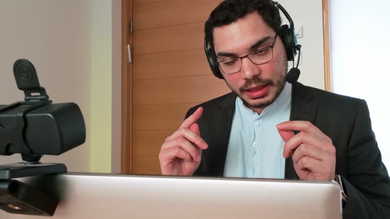 Man in business attire in a video conference