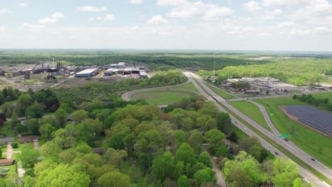 Aerial-view-of-solar-panels-in-field-near-town