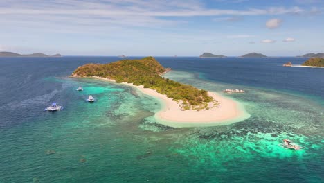 scenic view of manlihan island and its tranquil turquoise waters, linapacan, philippines