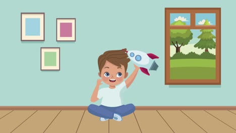 niño pequeño jugando con un cohete en la habitación