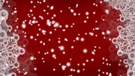 copos de nieve que forman un marco contra manchas blancas que caen contra un fondo rojo