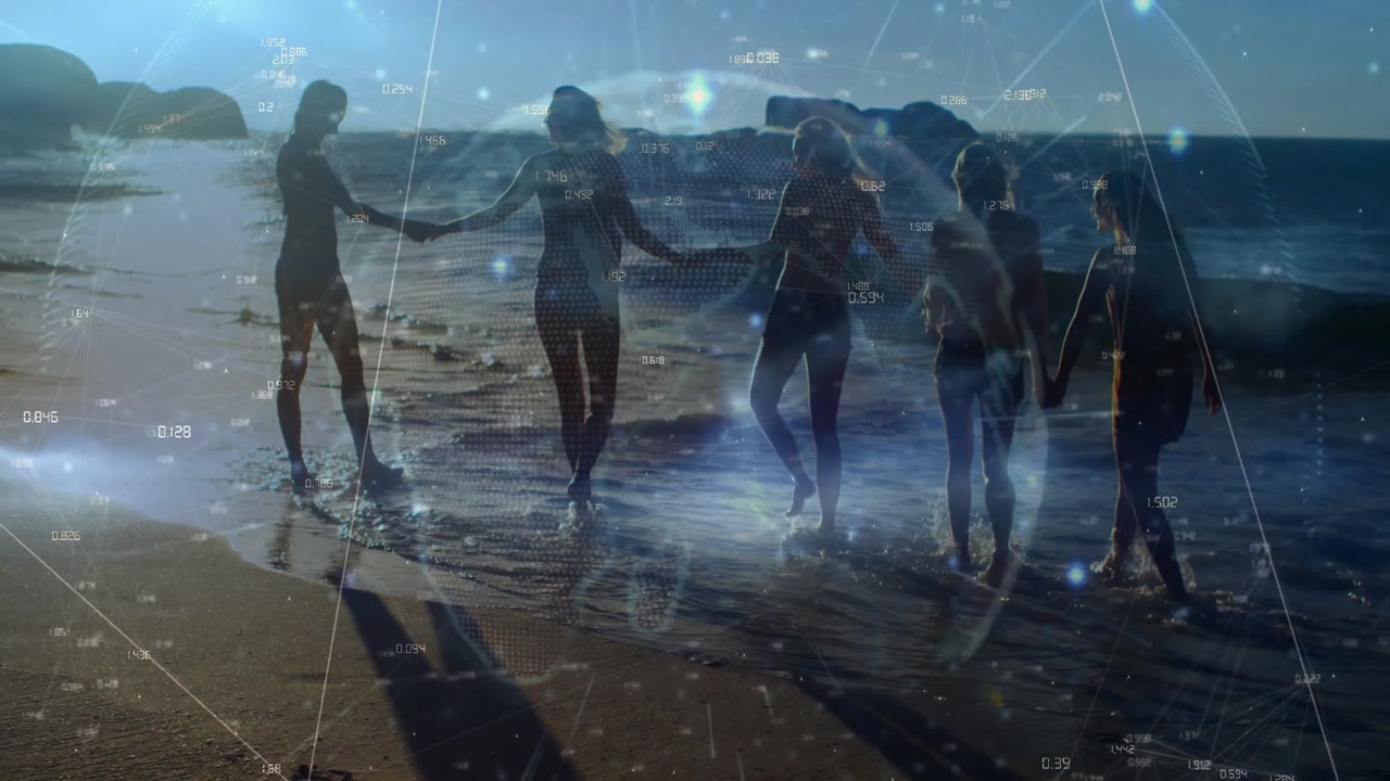 Five women holding hands stepping into surf being driven by tide while tech data sphere rotating