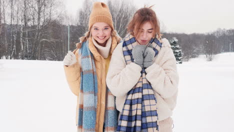 two friends enjoying a snowy day