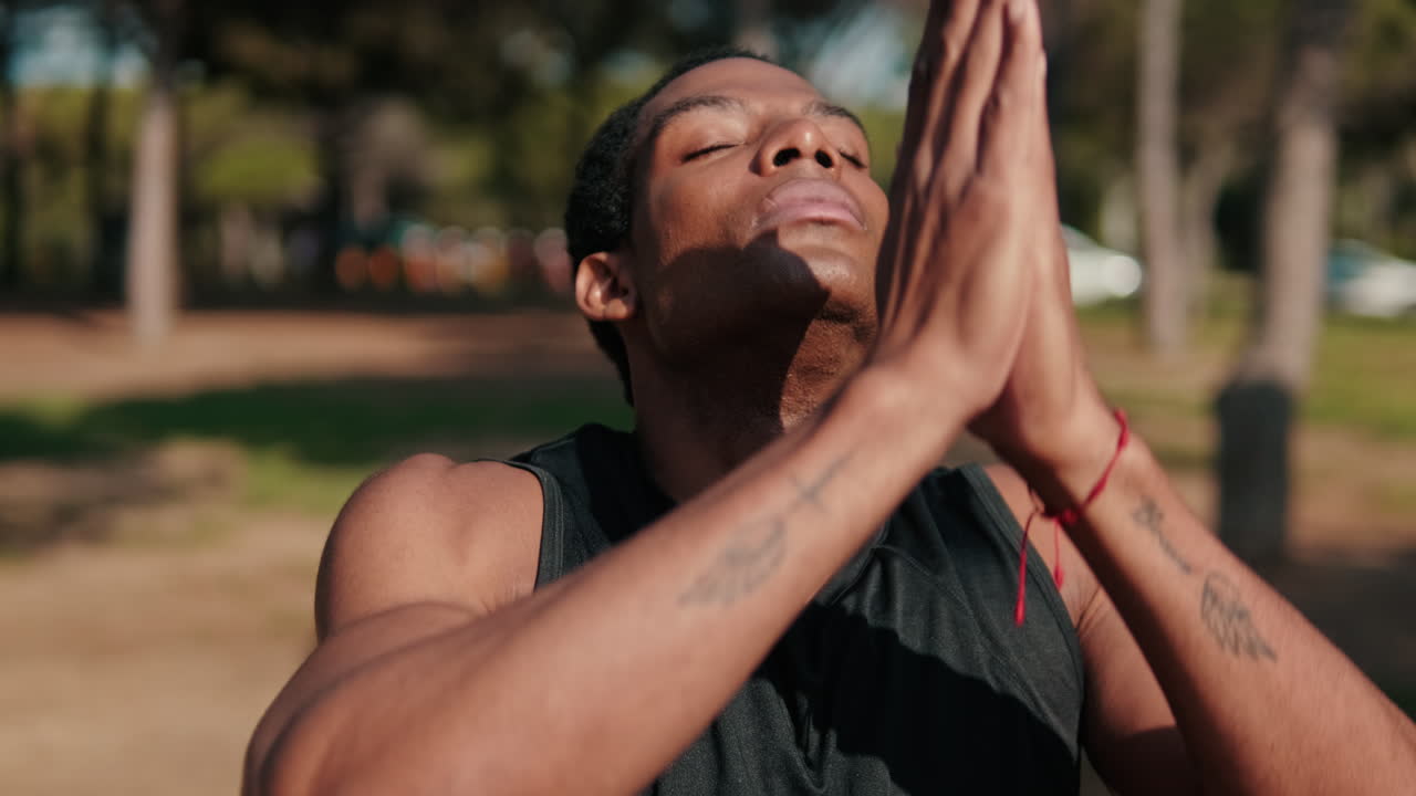 Muscular Man Meditates In The Park