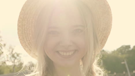 woman with straw hat and flowers