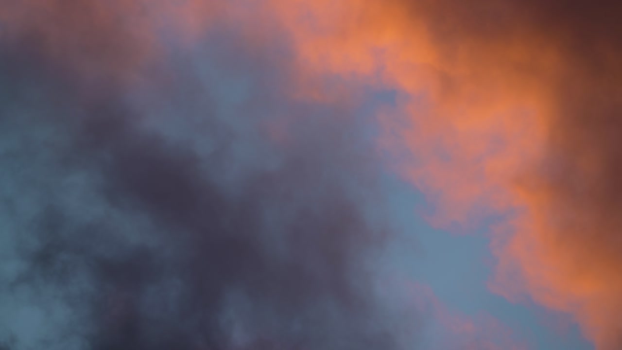 Towering Cumulonimbus Clouds Moving Across Evening Skyline