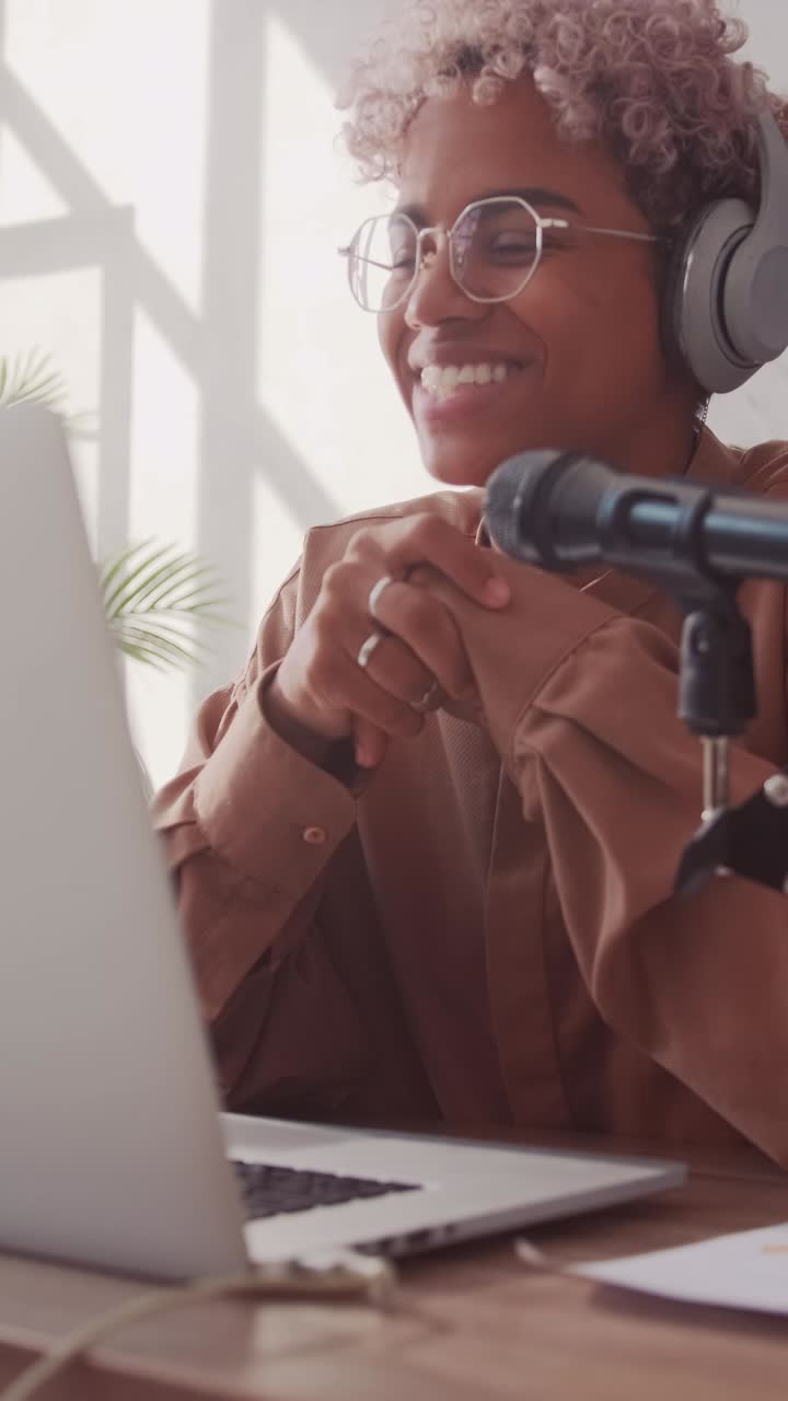 Young serious african american woman customer service specialist at work